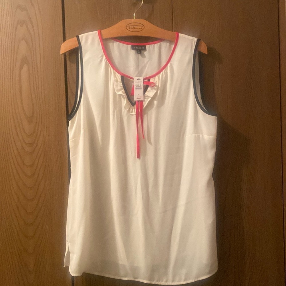 Brand new, never worn sleeveless polyester top with black and red trim